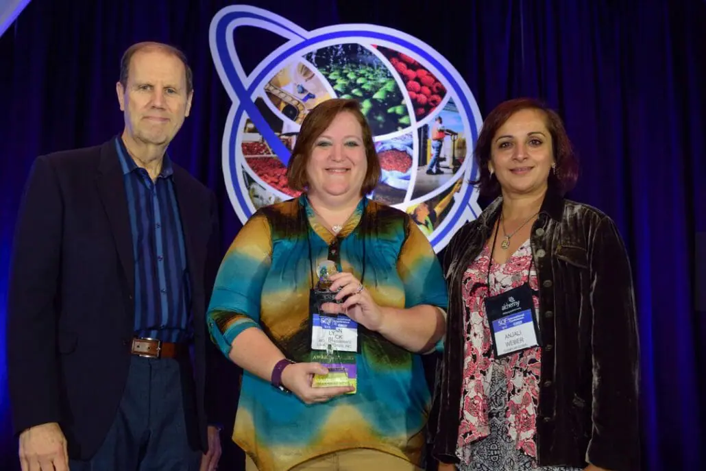 (L-R) Robert Garfield, SQFI, Senior Vice President, Lynn Buck, SQF Practitioner of the Year 2016, Anjali Weber, Vice President, Exemplar Global, Inc